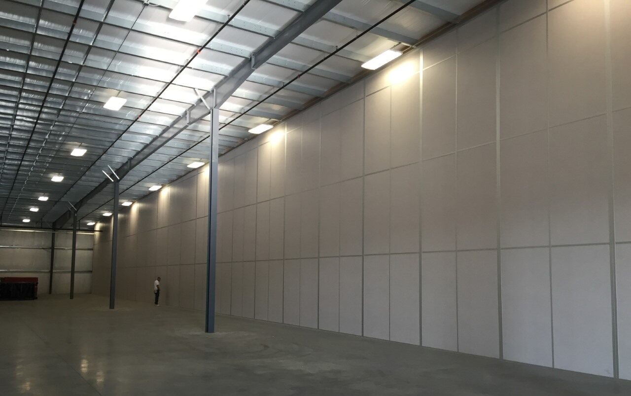 A modular tall wall (demising wall) application within a warehouse.
