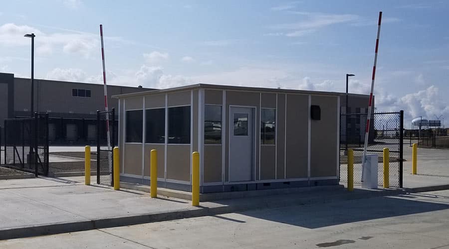 A modular gate house installed at an industrial facility entrance.