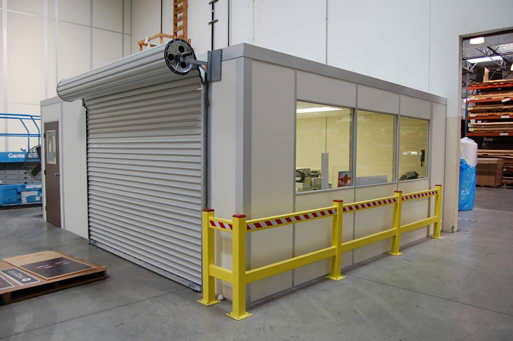 An in-plant modular office with roll-up door.