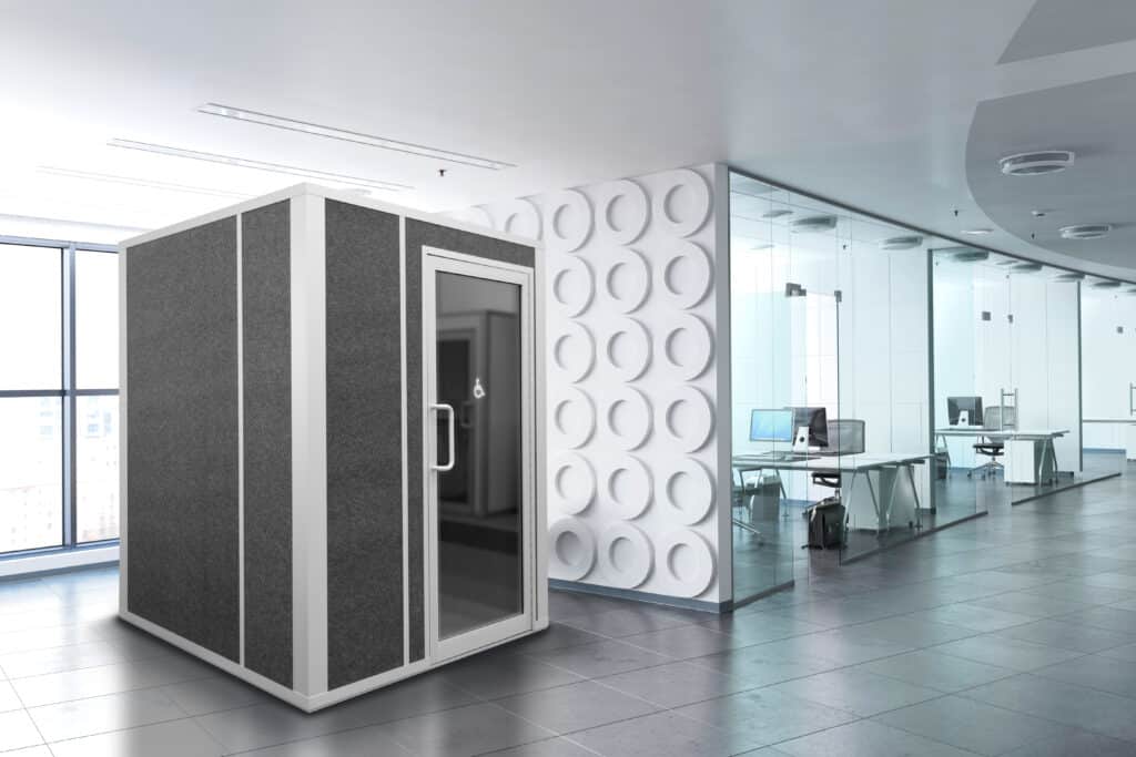 A modern lactation pod situated in an office environment provides a private and comfortable space for nursing mothers.