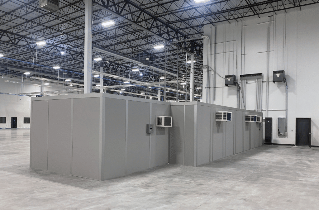 In-plant office facilities within a large warehouse.