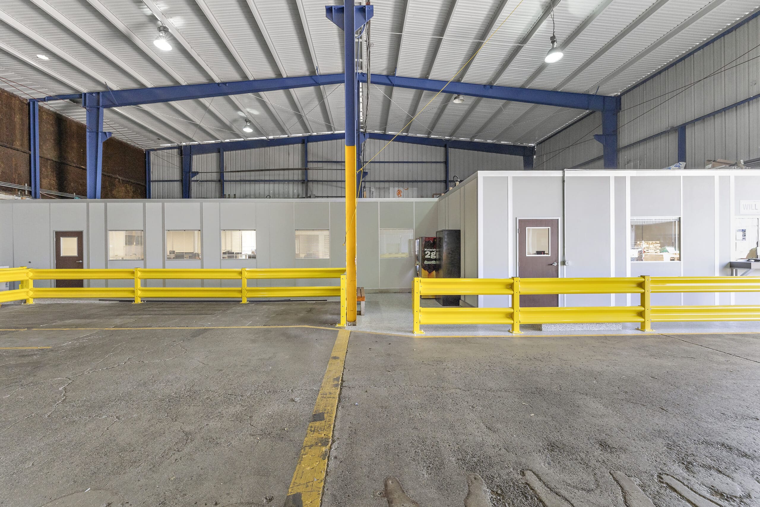 A large office within a warehouse.