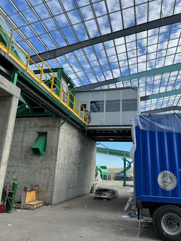 A mezzanine near the ceiling with yellow guardrail.
