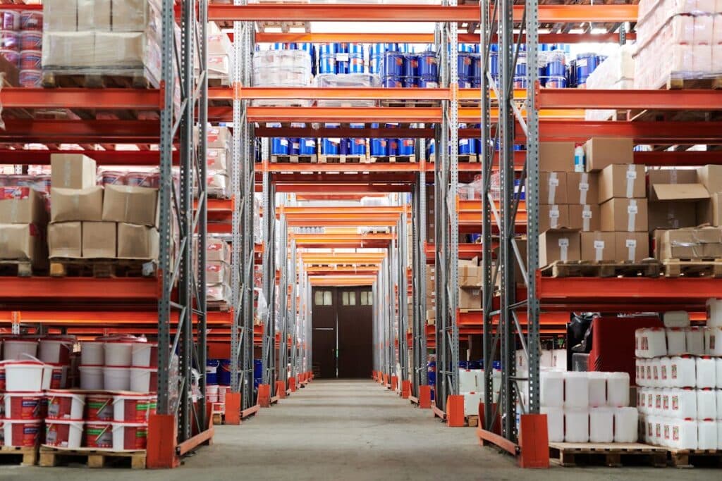 A well-organized warehouse with neatly stacked shelves and clear pathways.