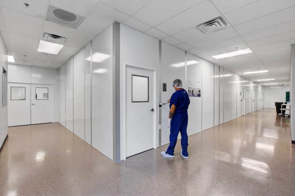 A modular cool down room installed in an industrial setting, featuring air conditioning, windows for visibility, and a secure door for controlled access. The space provides a cool environment where workers can take breaks and recover from heat exposure by allied modular building system - modular buildings