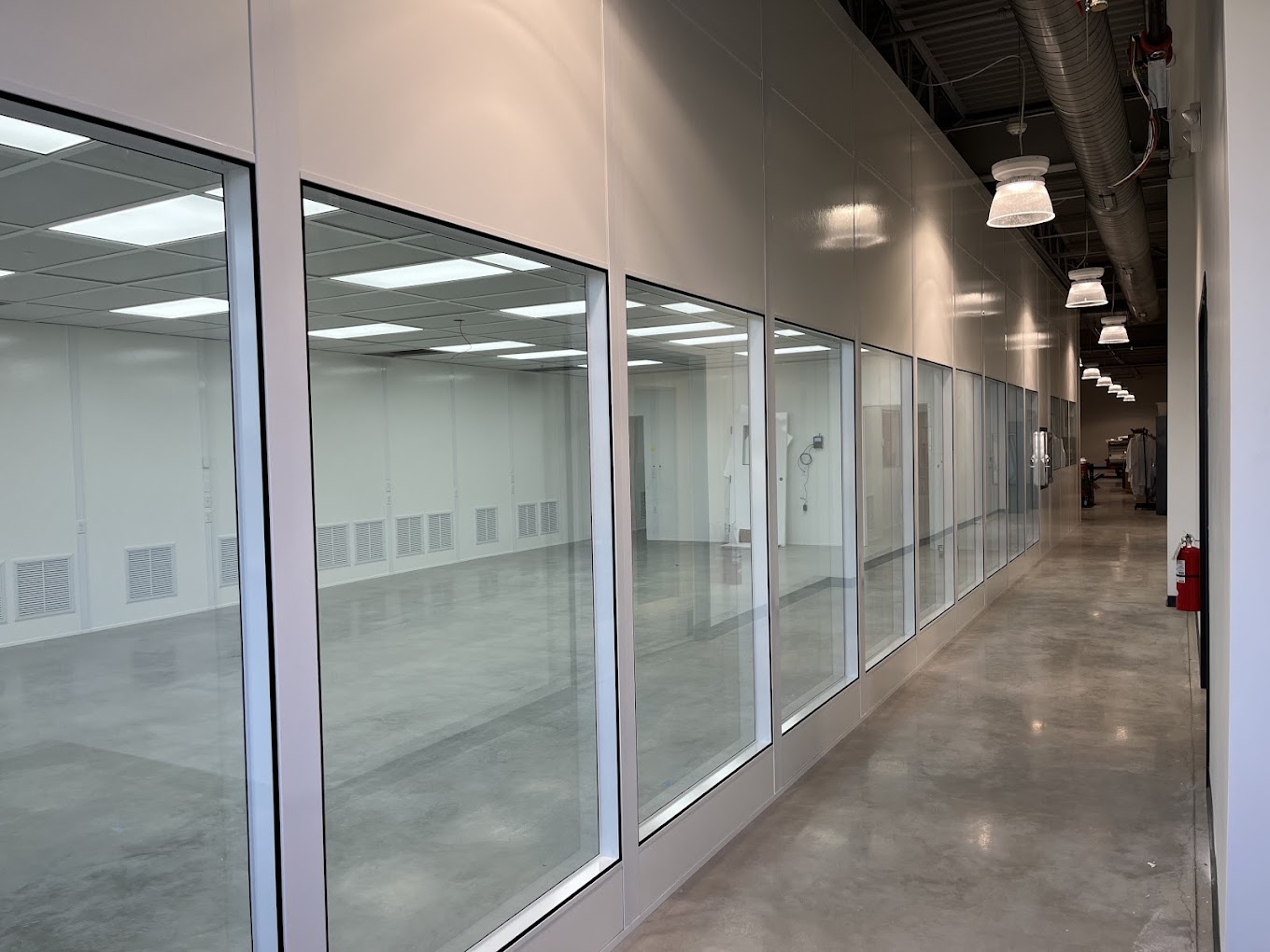 Modular commercial interior with glass panels by Allied Modular.