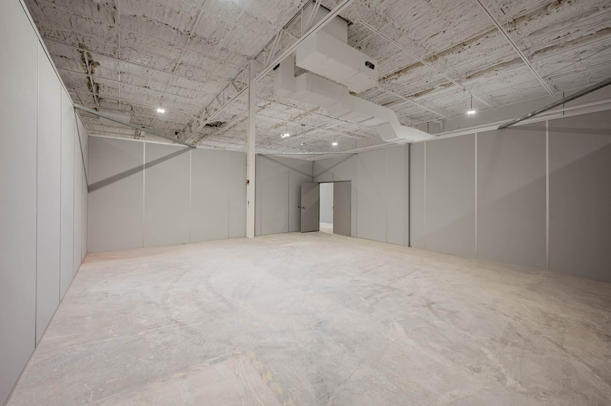 Modular interior space with gray partition walls by Allied Modular.