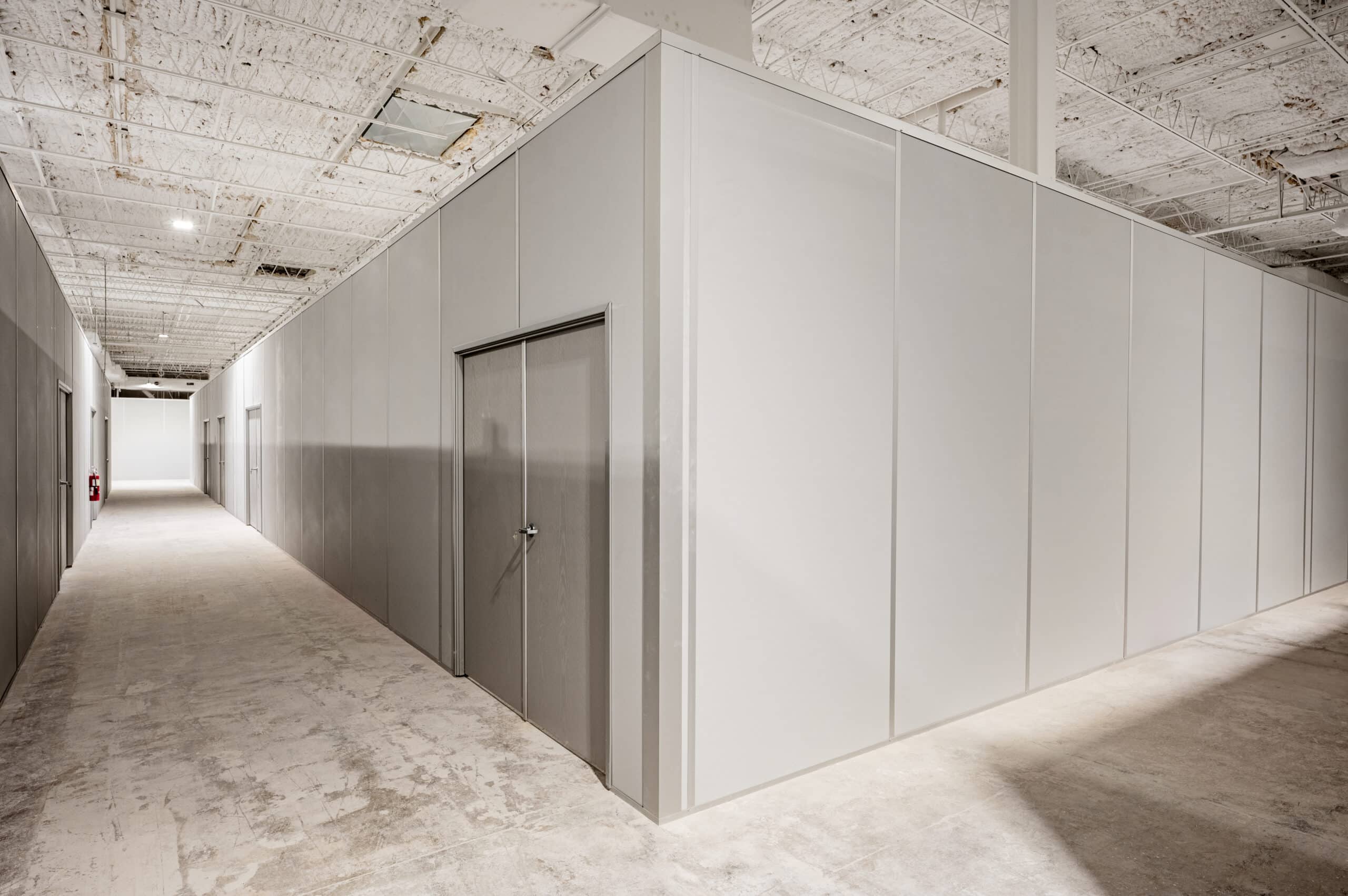 Modular warehouse office with double doors by Allied Modular.