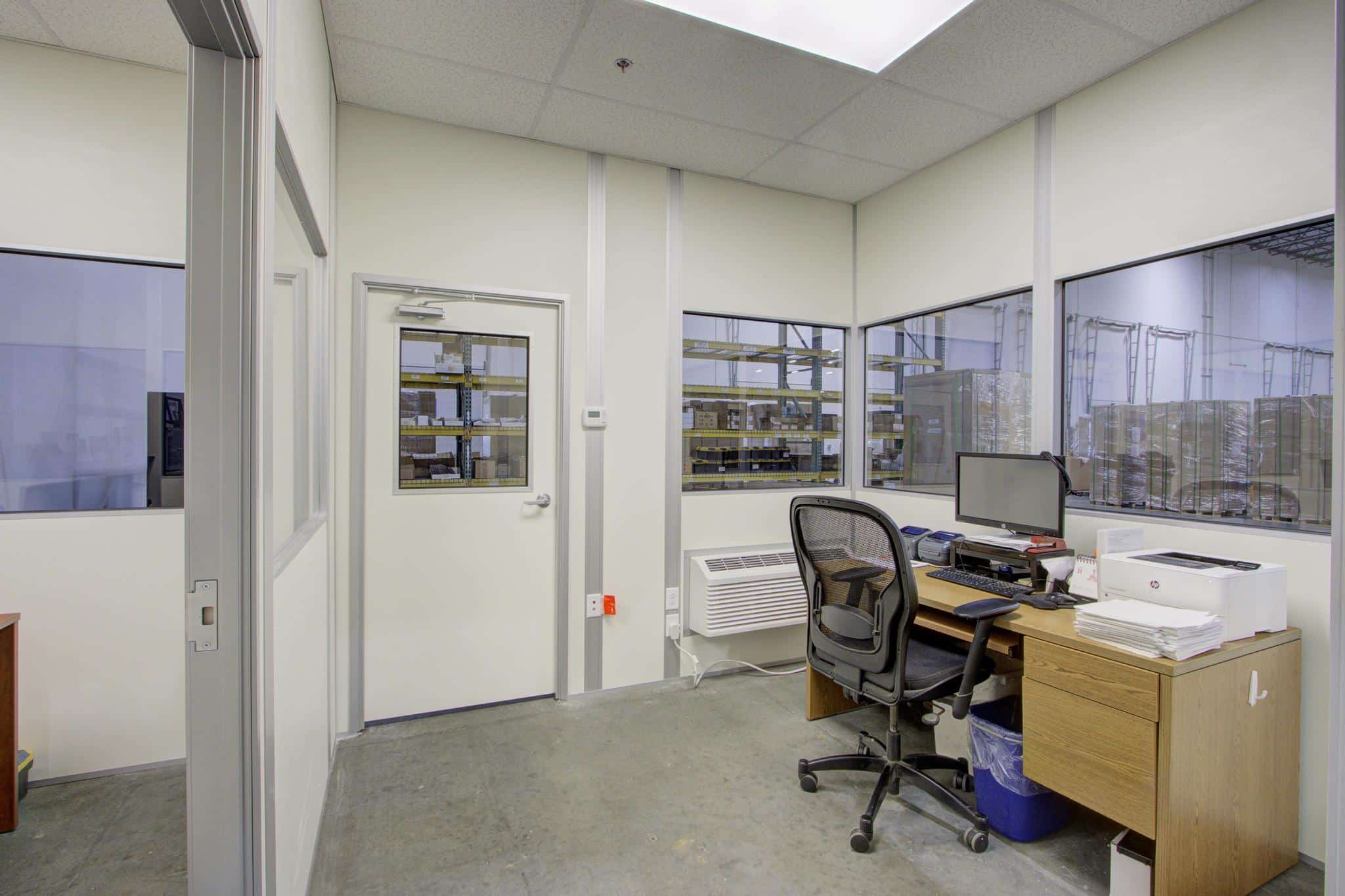 Interior of temporary office buildings by Allied Modular, used as a temporary office building inside a warehouse.